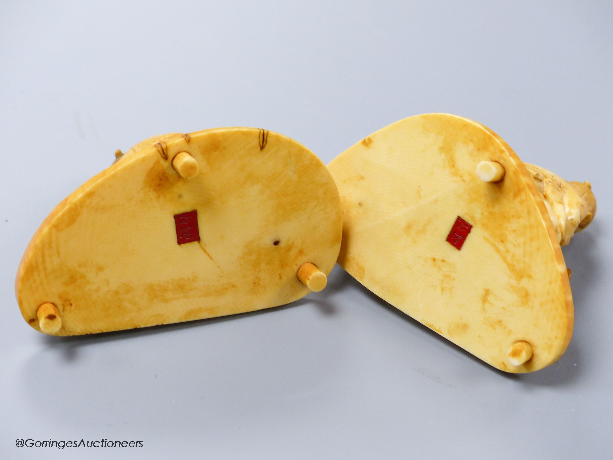 Two Japanese ivory okimono of a craftsman